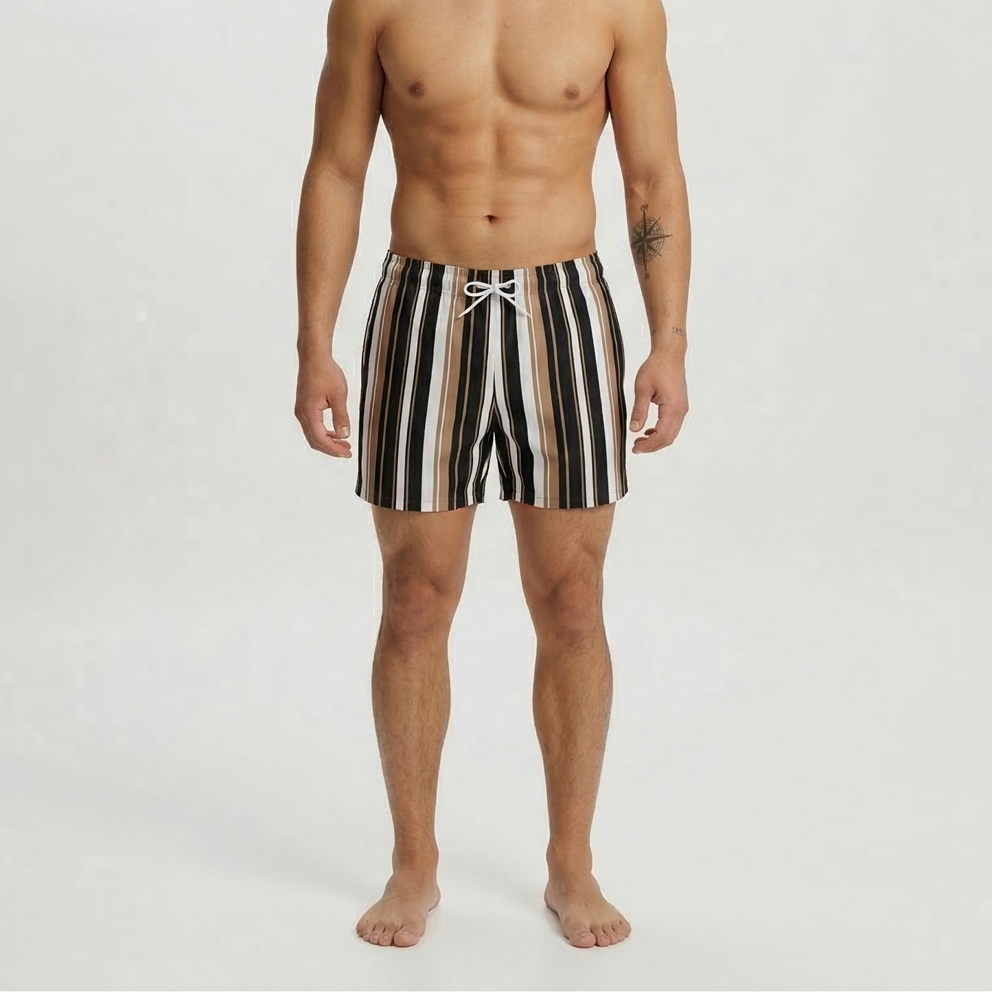 Man wearing mocha striped swim shorts on a white background